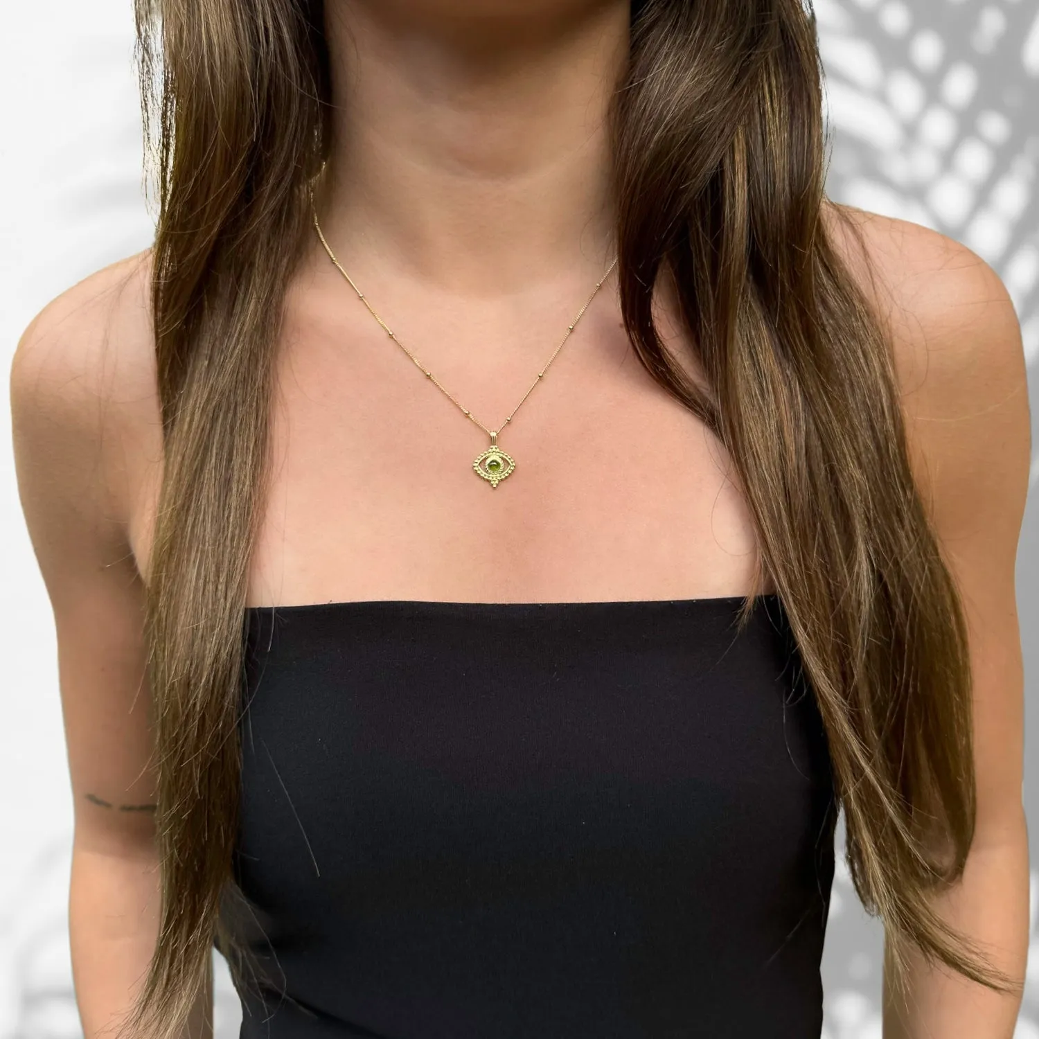 Tourmaline Evil Eye Pendant on a Stylish Gold Chain Necklace
